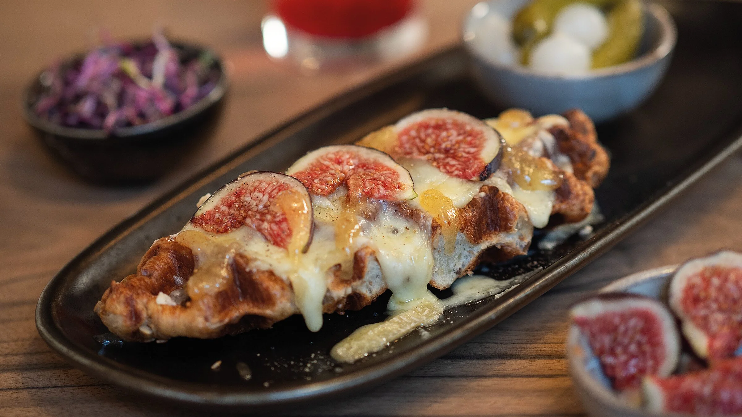 Raclette croffle with glacier raclette and figs at Pförtnerhaus Basel